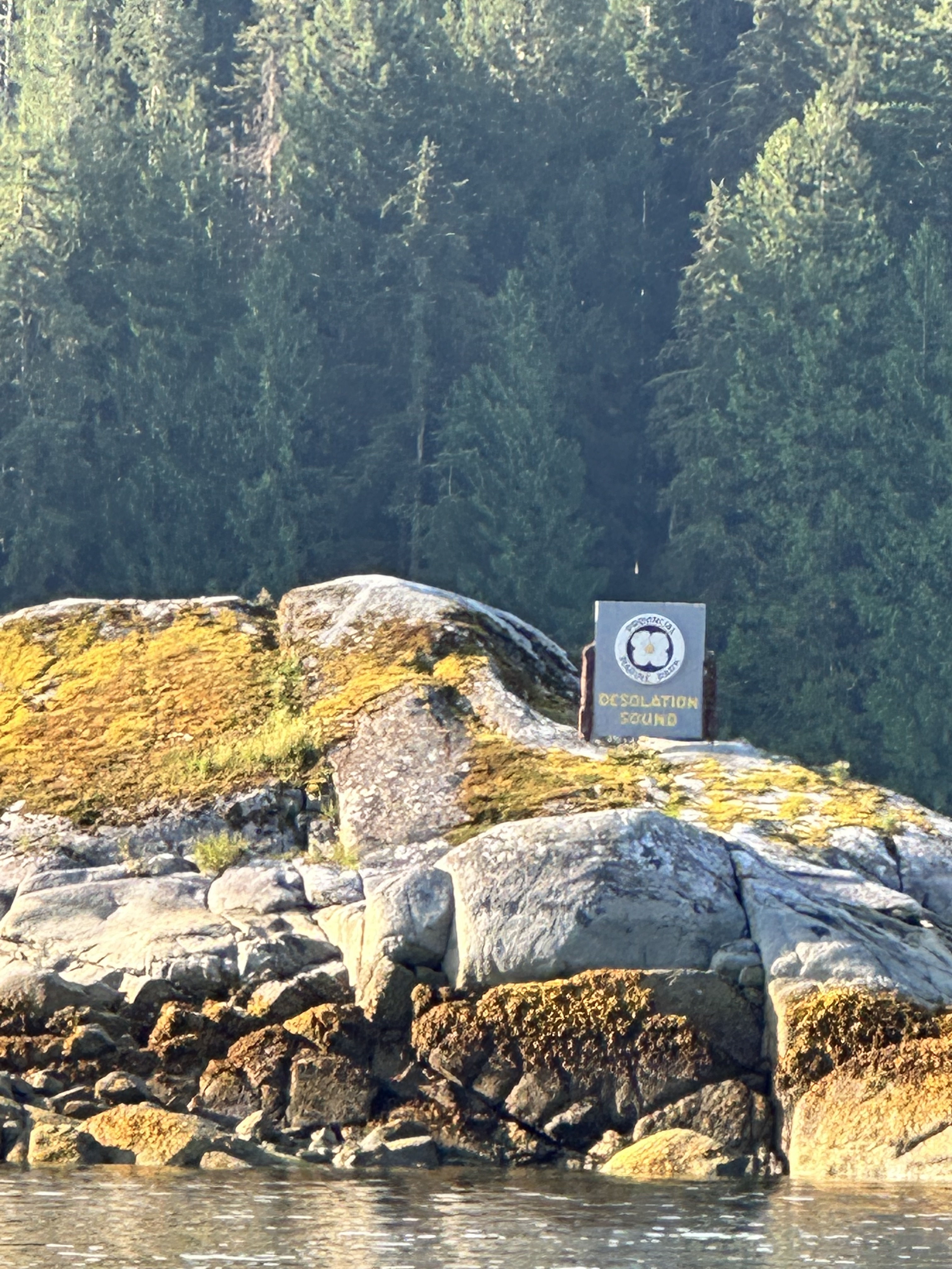 Desolation Sound sign on the rocky shoreline